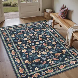 Floral area rug with intricate patterns in a dark color palette, placed on a wooden floor near a bench with pillows, a throw, and a basket of books.