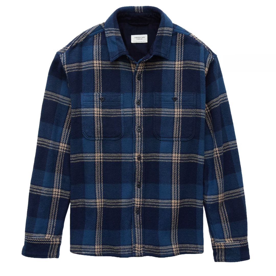 A blue and beige plaid flannel shirt with long sleeves, button front, and dual chest pockets.