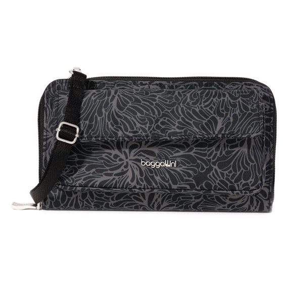 A Baggalini crossbody purse with a floral pattern, featuring an adjustable strap and a zippered closure.
