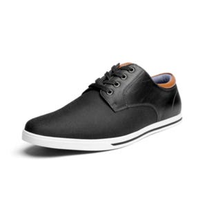 Black lace-up casual shoe with a smooth finish, a white sole, and brown accents on the collar.