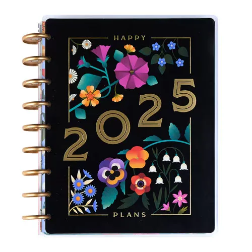 A black cover planner with \“2025\“ and \“HAPPY PLANS\“ in gold letters, adorned with colorful floral illustrations and gold spiral binding.