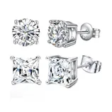 Two pairs of stud earrings: one with round-cut stones and the other with square-cut stones, both set in sterling silver with a \“925\“ hallmark.