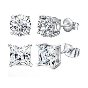 Two pairs of stud earrings: one with round-cut stones and the other with square-cut stones, both set in sterling silver with a \“925\“ hallmark.