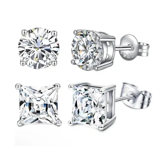 Two pairs of stud earrings: one with round-cut stones and the other with square-cut stones, both set in sterling silver with a \“925\“ hallmark.