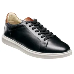A sleek black leather sneaker with black laces, featuring a tan detail on the heel and a white sole.