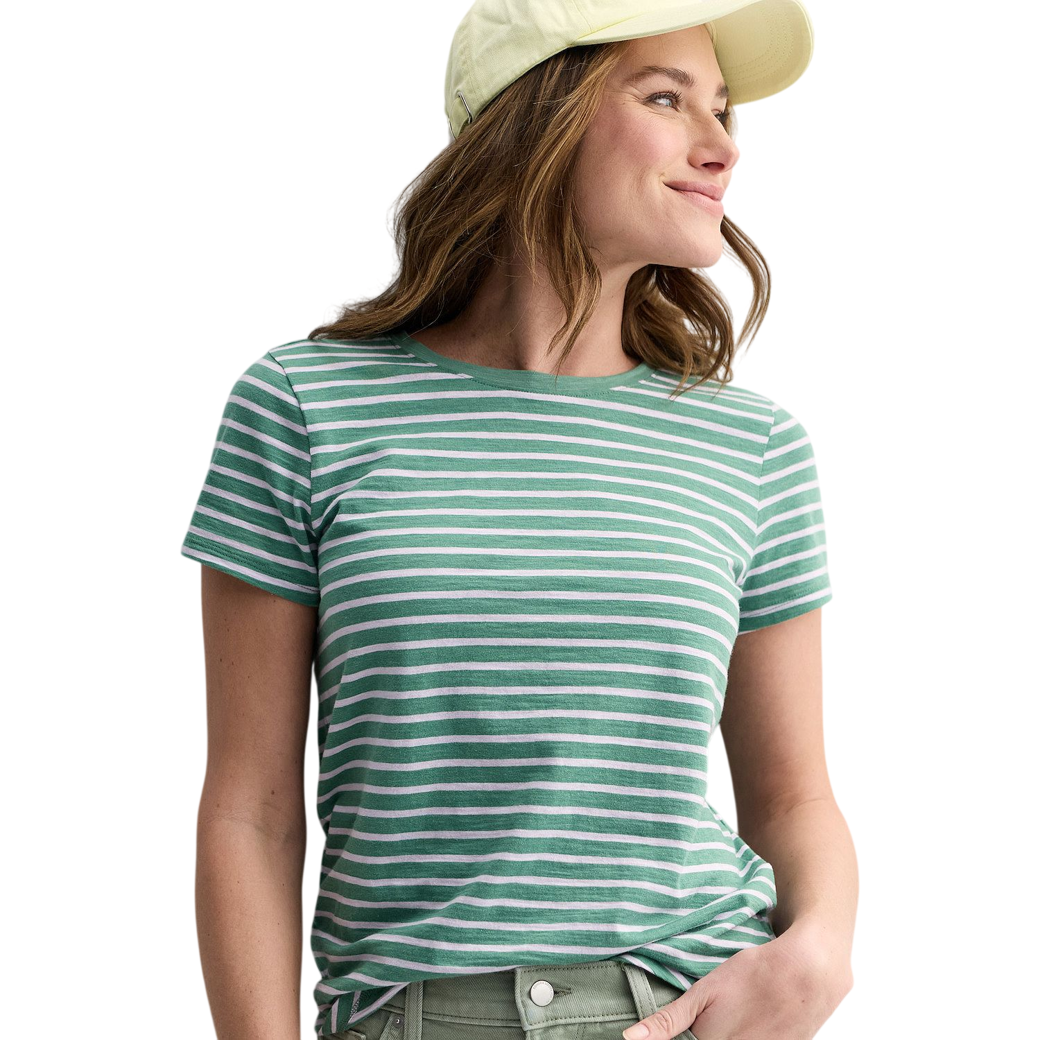A person is wearing a green and white striped t-shirt paired with green pants and a light yellow baseball cap.