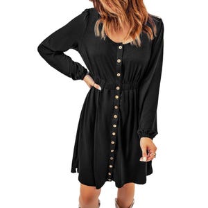 A black long-sleeve dress with front buttons and an elastic waistband. The dress has a scoop neckline and a knee-length hem.