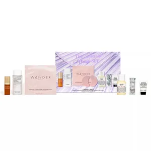 A Macy's travel-ready set featuring skincare items including Wander Beauty eye masks, Tonymoly products, and Kiehl's lotion, among others, in a purple box marked \“The Travel Ready Set.\“