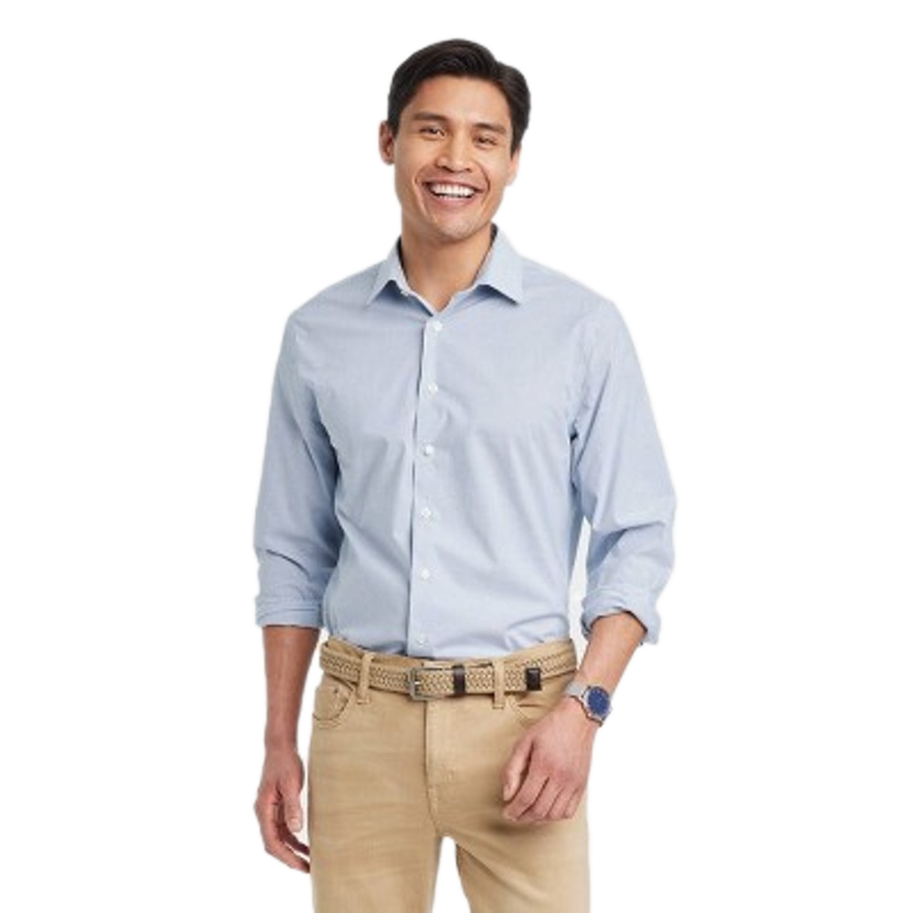 Man wearing a light blue dress shirt with rolled-up sleeves, beige pants, a woven beige belt, and a blue watch.