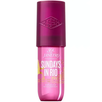 Sol de Janeiro Sundays in Rio Perfume Mist features a pink bottle with a purple cap, adorned with yellow graphics and text.