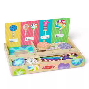 A wooden toy set featuring colorful pretend lollipops and sweets, displayed in a box with compartments and a price label board.