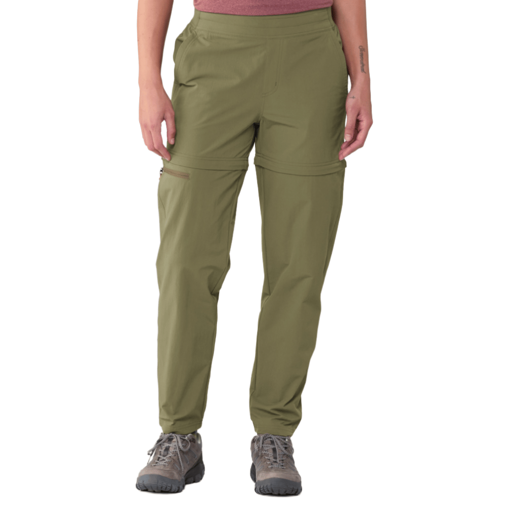 Olive green convertible hiking pants with zip-off legs, worn with gray hiking boots and a pink top.