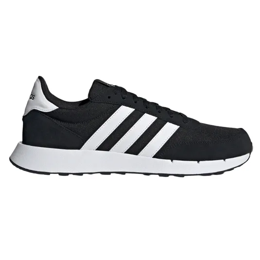 A black Adidas sneaker with white stripes and a white sole.