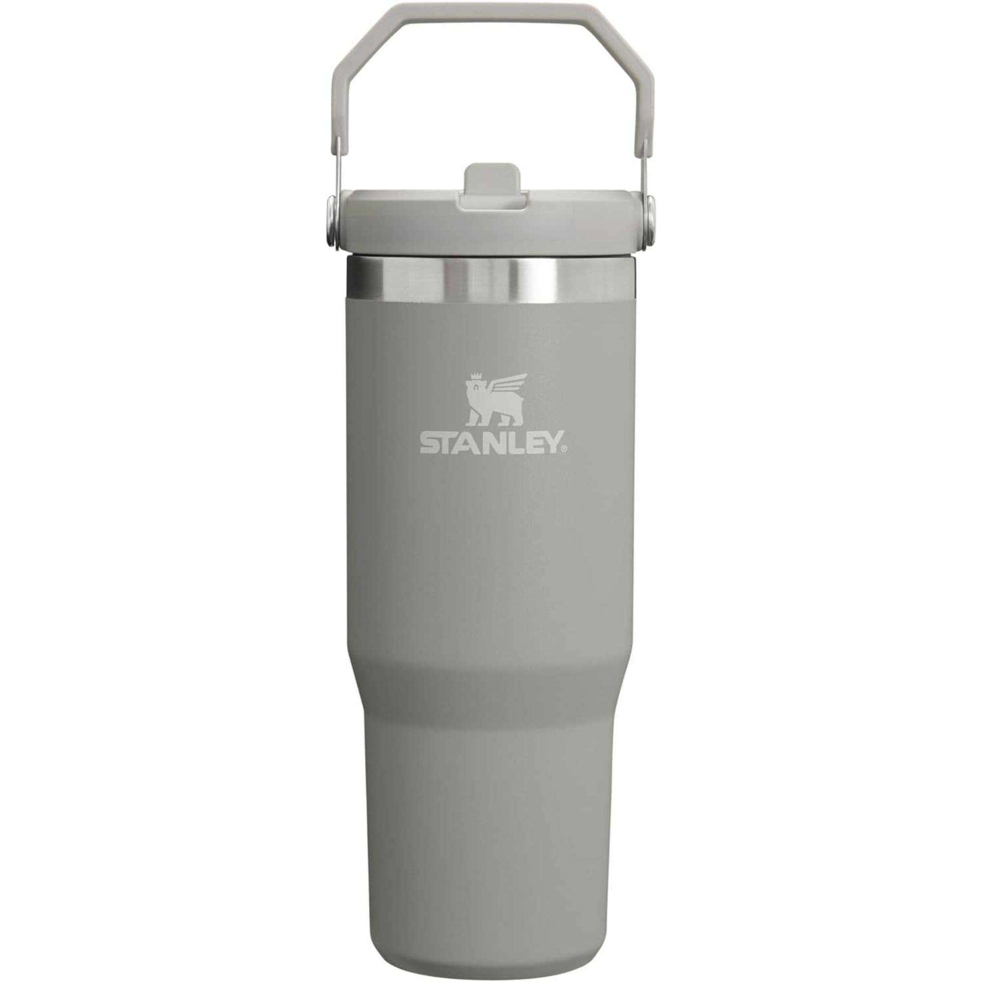 Stanley gray insulated tumbler with a handle on the lid, featuring the Stanley logo.