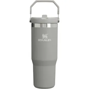 Stanley gray insulated tumbler with a handle on the lid, featuring the Stanley logo.
