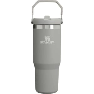 Stanley gray insulated tumbler with a handle on the lid, featuring the Stanley logo.