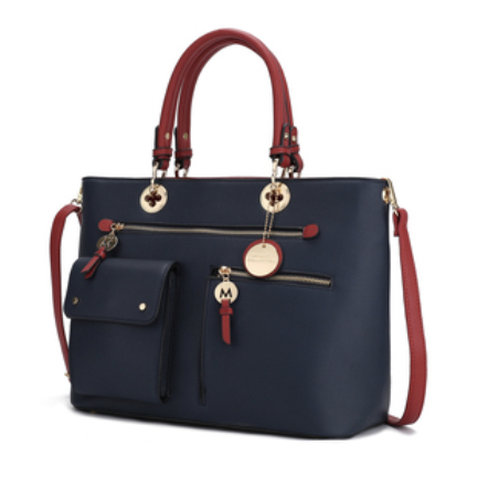 A stylish handbag with a navy blue body and red handles, featuring gold accents, a front pocket, and a detachable strap.