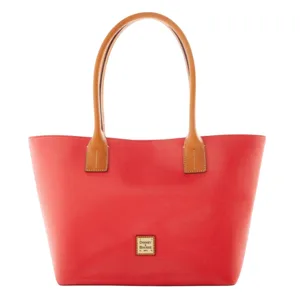 A red tote bag with tan handles featuring a small, centered logo plaque on the front.