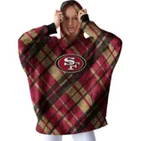 A person wears a plaid hooded garment featuring the San Francisco 49ers logo in red, gold, and black.