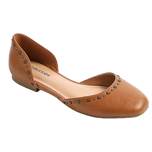 A tan flat shoe with small round metal studs along the edges. The shoe features a d'Orsay cut with an open side and a low heel.