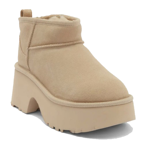 Beige platform ankle boot with a thick sole and rounded toe.