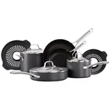 A cookware set including saucepans, skillets, and pots with lids, made of dark material with metallic handles, accompanied by two circular silicone trivets.
