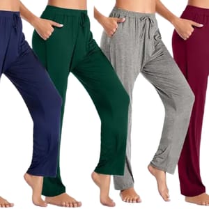Four pairs of lounge pants in navy, dark green, gray, and maroon, each with an elastic waistband and drawstring, modeled by barefoot individuals.