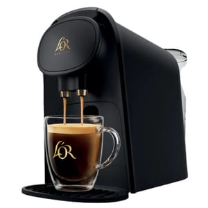The L'Or Barista Coffee & Espresso Maker is a sleek black machine featuring a dual spout design, pouring espresso into a glass cup with the L'Or logo.