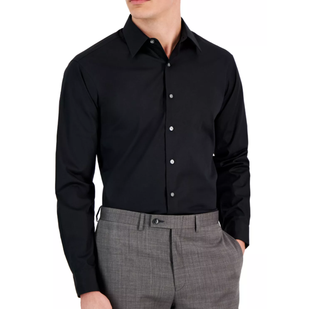 A man is wearing a black dress shirt with long sleeves and gray dress trousers.