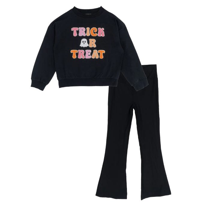 Black sweatshirt with \“Trick or Treat\“ text in colorful letters and a ghost graphic, paired with black flared pants.