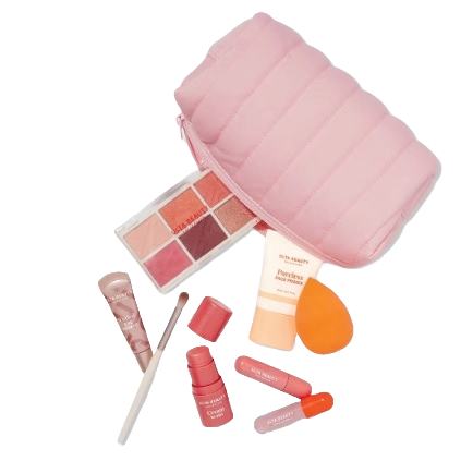 A makeup set with pink cosmetics bag, eyeshadow palette, sponge, lip gloss, nail polish, and a brush.