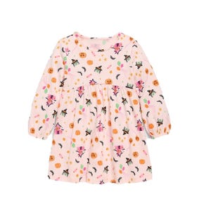 A children's long-sleeve dress with a Halloween theme, featuring prints of witches, pumpkins, bat motifs, and stars on a light pink background.