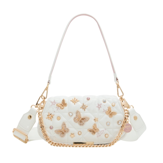 The Aldo X Wicked Glinda Shoulder Bag is a light-colored, quilted bag featuring gold butterfly and star embellishments. It has a chain strap and a decorative shoulder strap with gold-tone hardware.