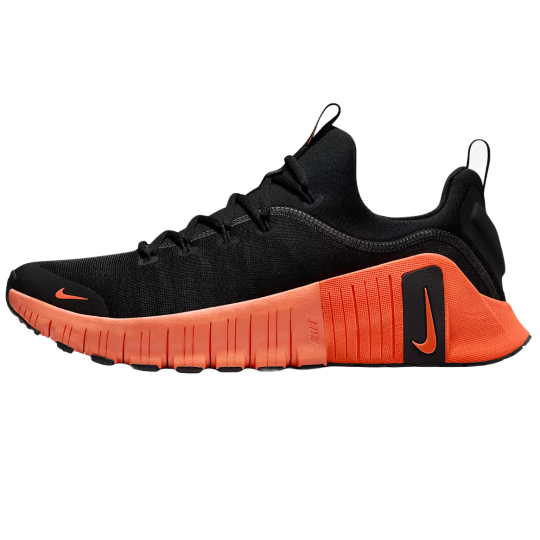 The Nike Free Metcon 6 shoes feature a black upper with an orange midsole and rubber detailing. They are designed for flexibility and support, suitable for intense workouts.