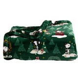 A green fleece blanket featuring holiday-themed cartoon dog designs, decorated with trees, stars, and festive elements.