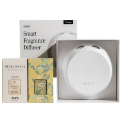 Pura Smart Fragrance Diffuser with Becki Owens' Coconut Calm and Anthropologie's Honeycrisp Oakwood fragrance refills.