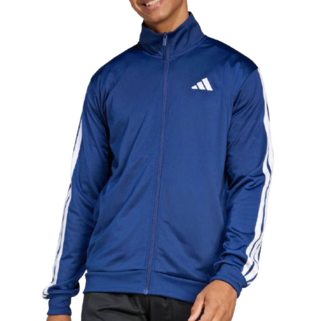 A person wearing a blue Adidas track jacket with white stripes on the sleeves and the Adidas logo on the chest.