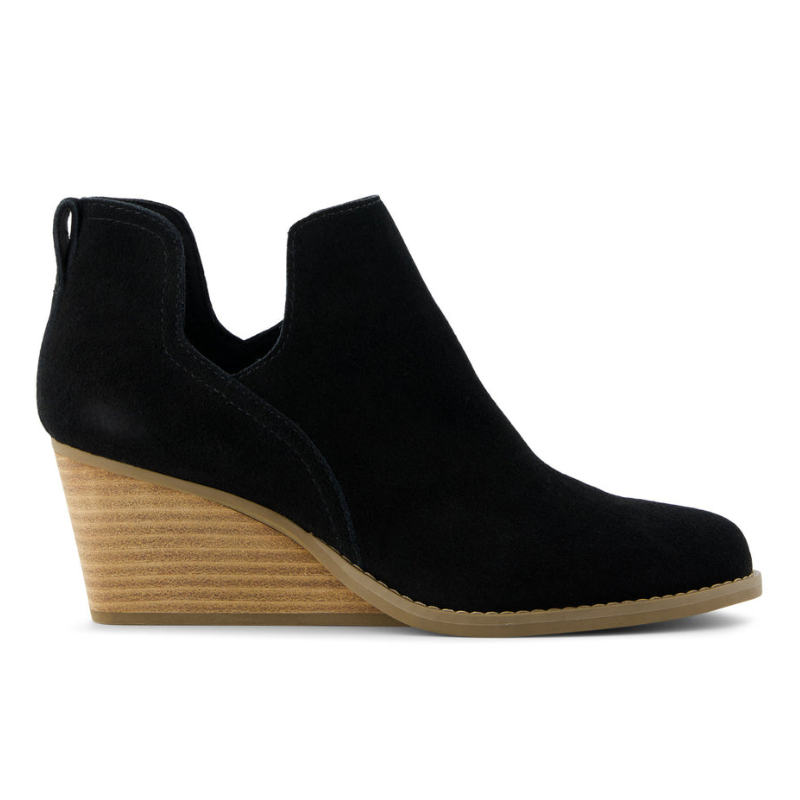 Black suede ankle boot with a stacked wedge heel and pull tab at the back.
