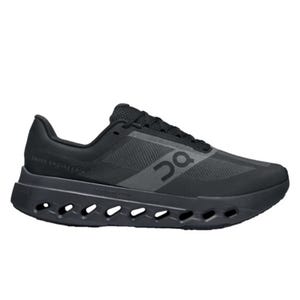 The On Cloudsurfer Next are black running shoes featuring a sleek design with a mesh upper for breathability and distinctive cut-out details in the sole for cushioning and flexibility.