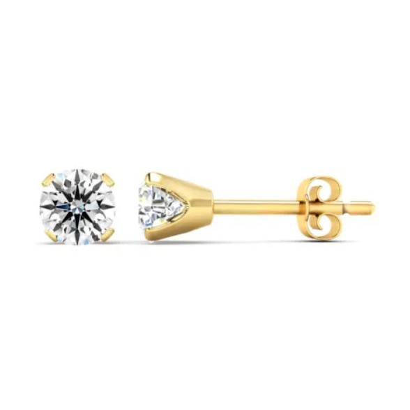 Yellow gold diamond studs featuring nearly 3/4 carat round diamonds, set in a four-prong design with a secure push-back closure.