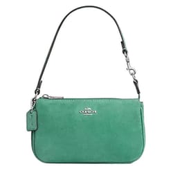 Green Coach wristlet with a silver logo, detachable strap, and signature tag.
