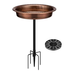 A copper-colored bird bath with a sturdy black metal stand and a separate round solar fountain.