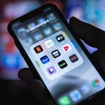 A smartphone screen displaying a folder labeled 'Entertainment' with app icons for various streaming services.