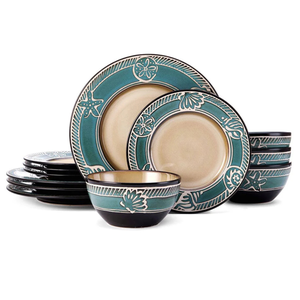 Pfaltzgraff dinnerware set, 16 pieces, with teal and cream floral and sea-themed designs, includes plates and bowls with a contrasting black rim.