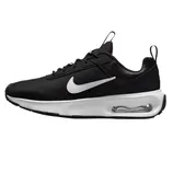 Black and white Nike sneaker with a visible air cushion in the sole, featuring the iconic white Swoosh logo on the side.