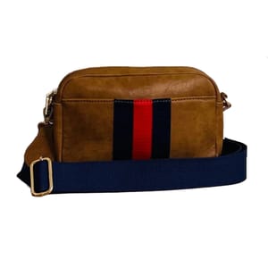 A brown crossbody bag with a prominent navy and red vertical stripe on the front, featuring a detachable navy strap with gold-tone hardware.