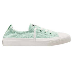 Light green low-top canvas sneaker with eyelet design, white laces, and rubber sole.