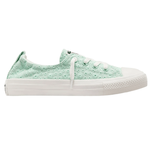 Light green low-top canvas sneaker with eyelet design, white laces, and rubber sole.