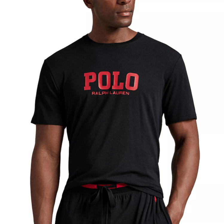 Black T-shirt with \“POLO RALPH LAUREN\“ in red font on the front, paired with black drawstring pants.