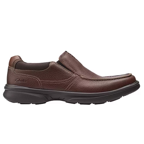Brown slip-on leather shoe with a textured upper and a dark, cushioned sole branded with \“Clarks\“ on the side.